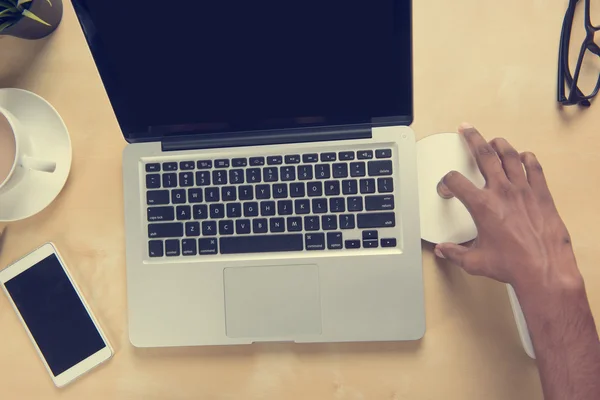 Hand inserting dvd to computer — Stock Photo, Image