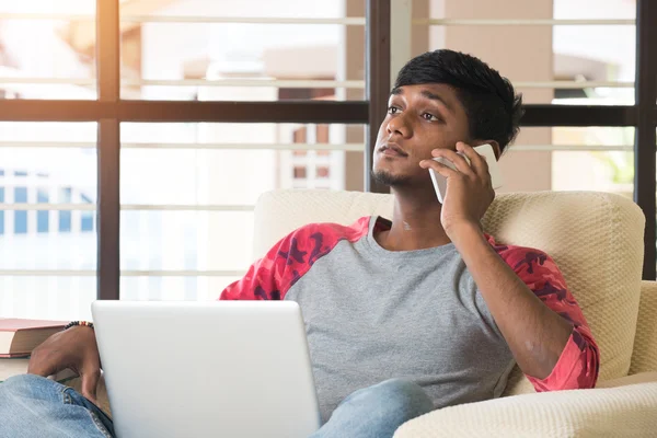 Teenage indian boy using laptop — Stock Photo, Image