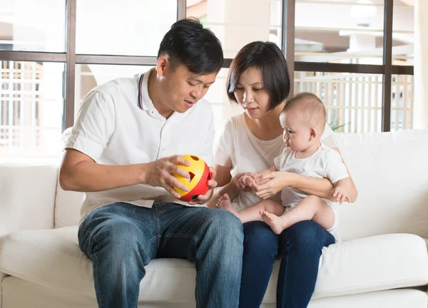 Asian parents playing with baby — Stock Photo, Image