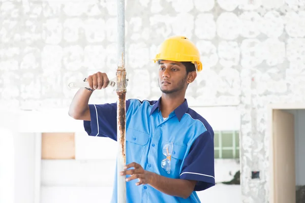 Indian male plumber on site — Stock Photo, Image