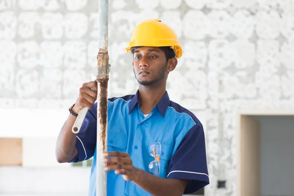 Indian male plumber on site — Stock Photo, Image