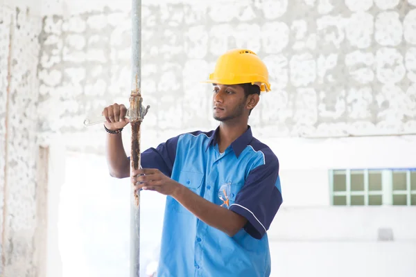 Indian male plumber on site — Stock Photo, Image