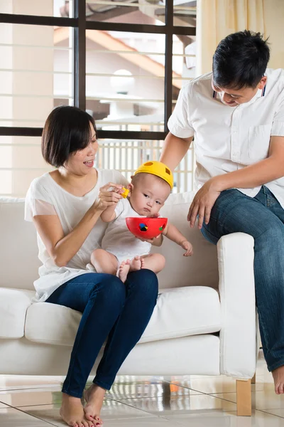 Asian parent playing with baby — Stock Photo, Image