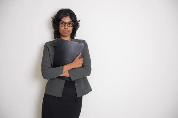 Indian business woman with serious look and plain background — Stock Photo, Image