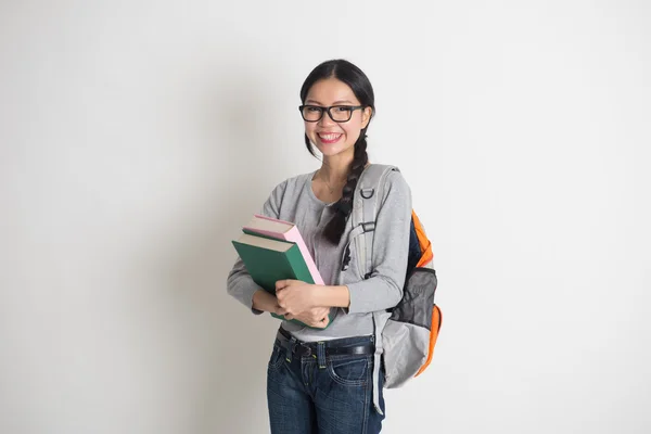 Ásia faculdade menina segurando um livro — Fotografia de Stock