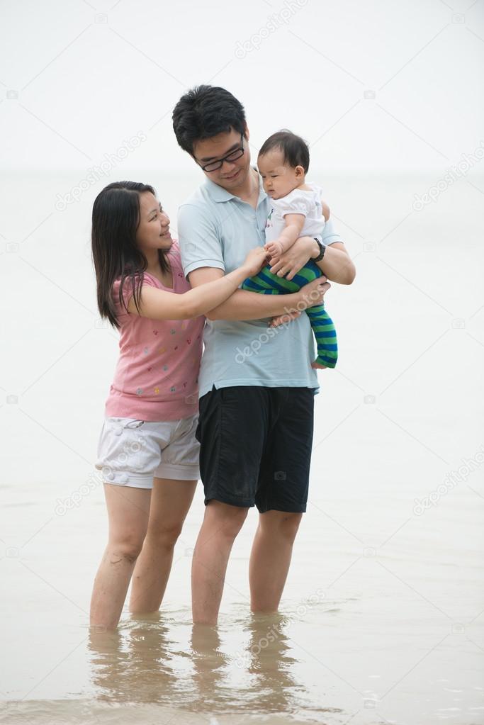 Asian family on beach