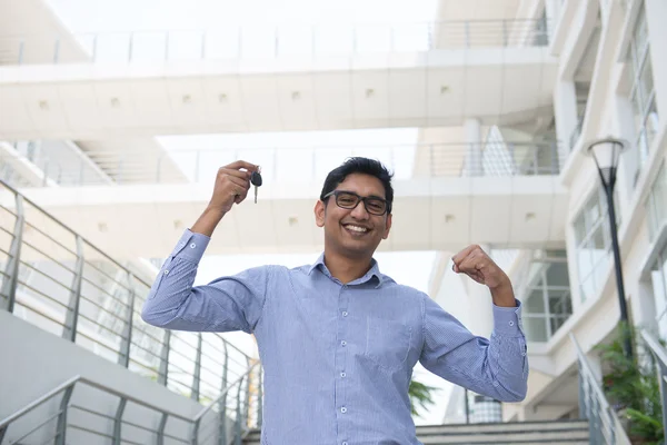 Salesman holding a key — Stock Photo, Image