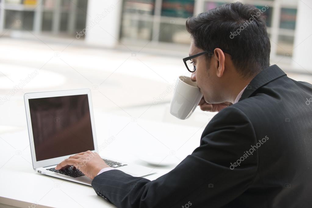 Indian business male on laptop