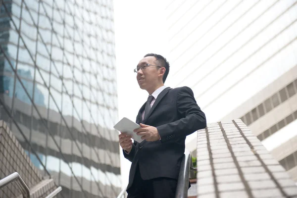 Asian businessman with tablet — Stock Photo, Image