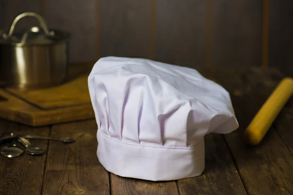 Chef hat with kitchen settings — Stock Photo, Image