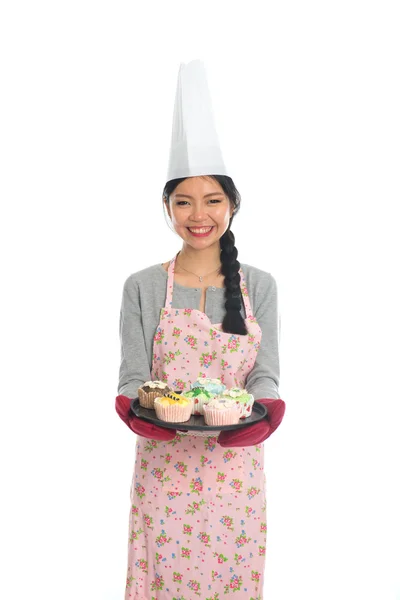 Asian girl baking bread and cupcakes — Stock Photo, Image