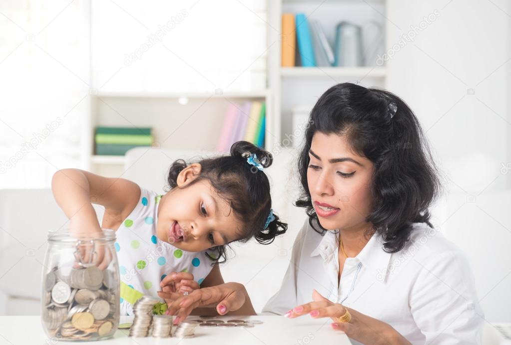 Mother and daughter with coins
