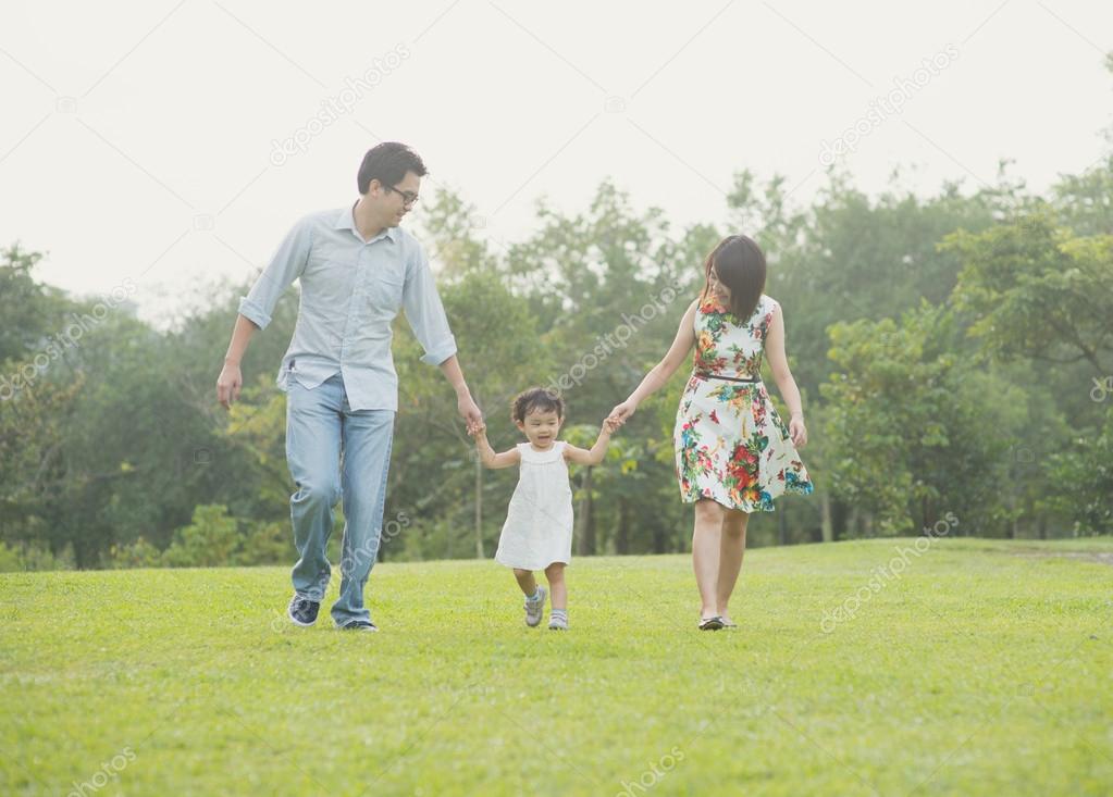 Happy Asian Family  together in the park