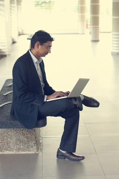 Indian businessman using laptop — Stock Photo, Image