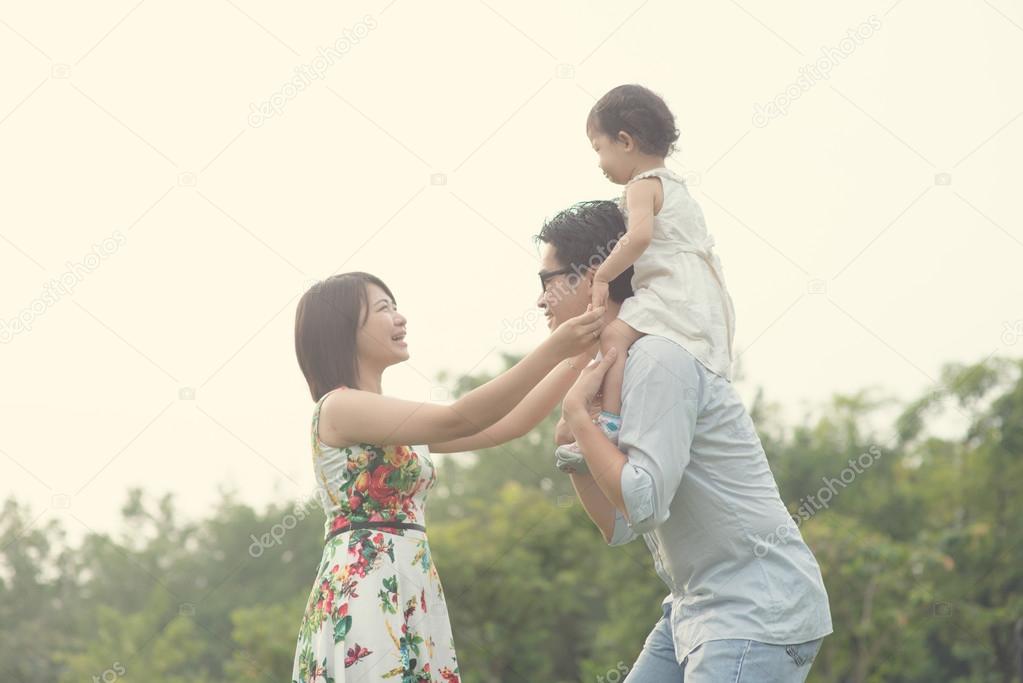 Asian family playing and enjoying