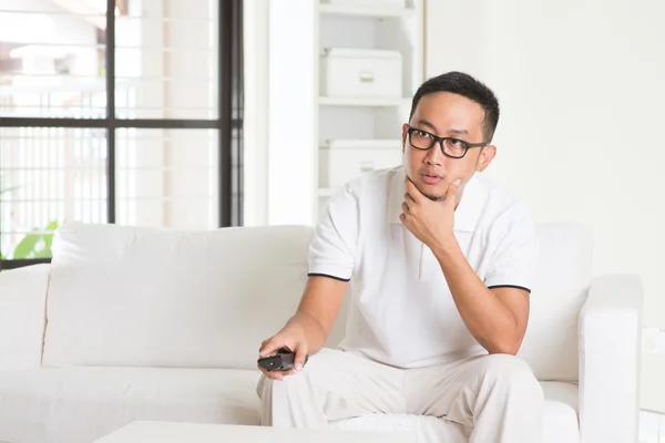 Asian male watching tv — Stock Photo, Image