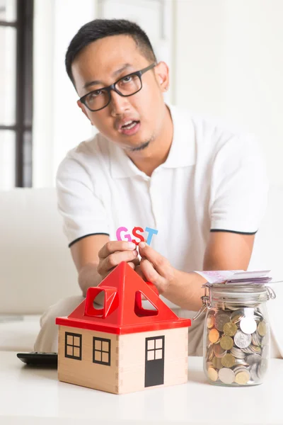 Asian male worried about taxes — Stock Photo, Image