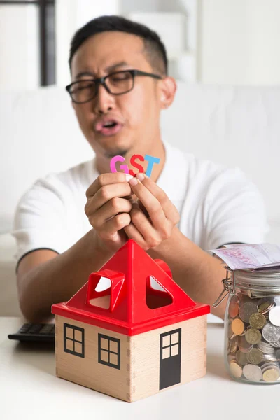 Asian male worried about taxes — Stock Photo, Image