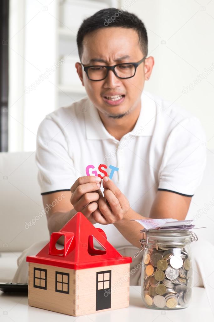 Asian male worried about taxes