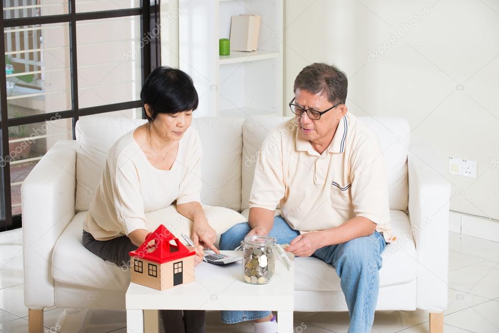 Asian senior couple calculating finance