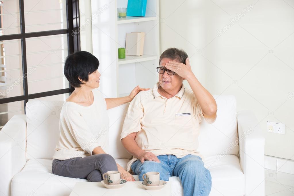 senior couple having headache