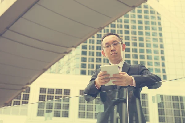 Chinese businessman with tablet computer — Stock Photo, Image