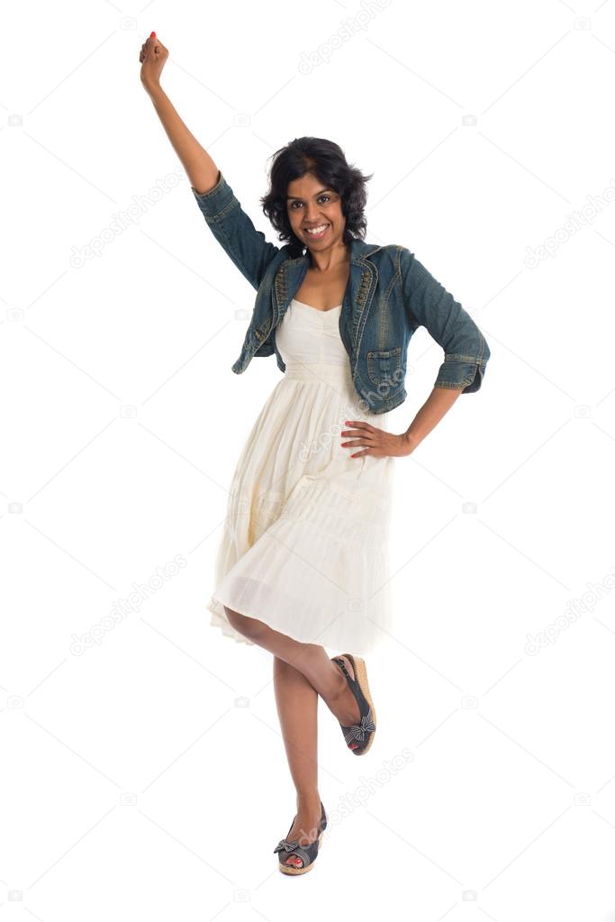 Happy woman celebrates and dancing