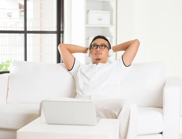 Asian man enjoying music — Stock Photo, Image