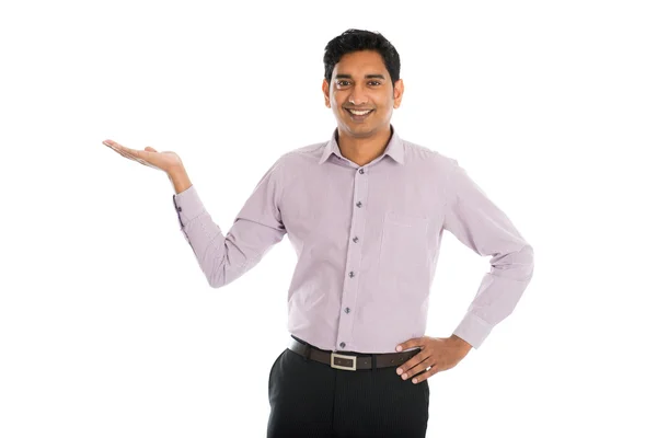 Businessman pointing at invisible product — Stock Photo, Image