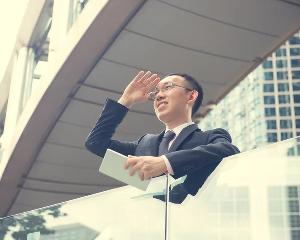 Asian Businessman using a touch pad — Stock Photo, Image