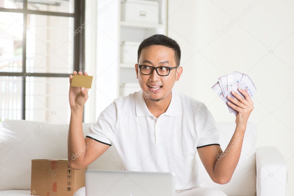 Man with cash and credit card