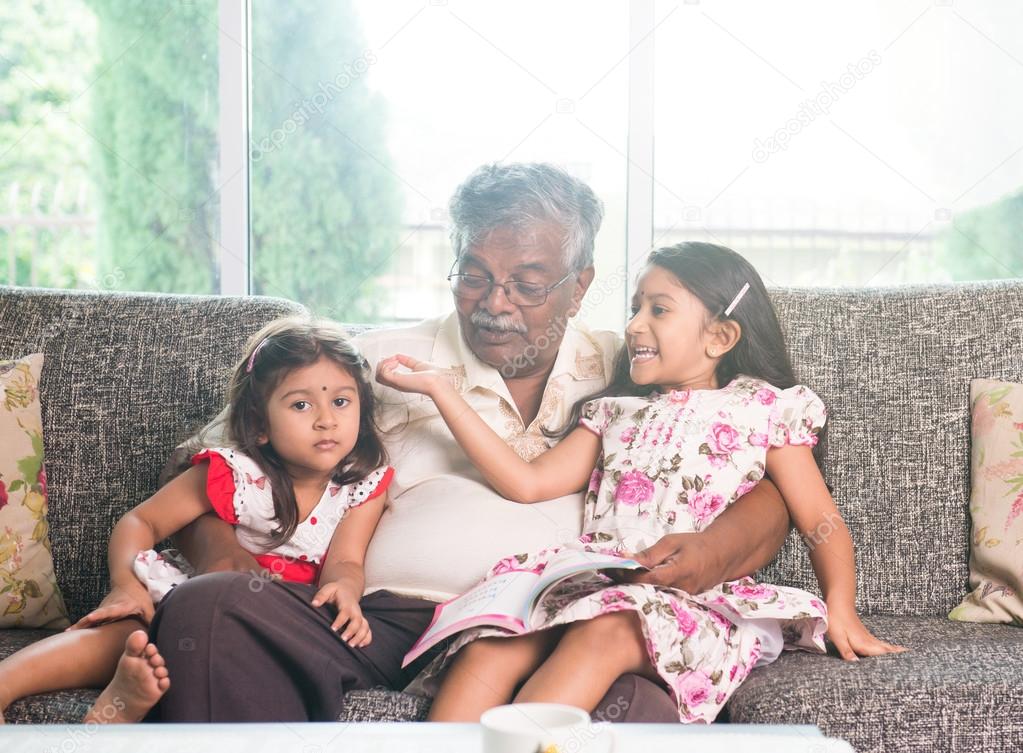indian grandfather learning with his granddaughters