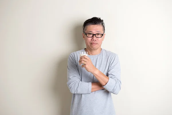 Asian man drinking milk — Stock Photo, Image