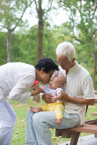 Grandparents playing with baby grandson — Stock Photo, Image