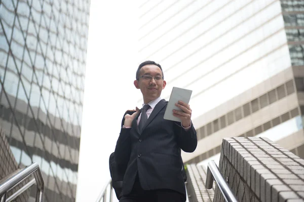 Chinese businessman with tablet computer — Stock Photo, Image