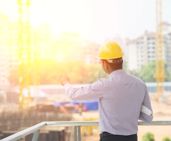 Indian engineer on construction background — Stock Photo, Image