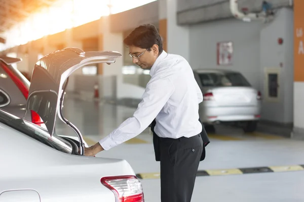 Indian business in car park — Stock Photo, Image