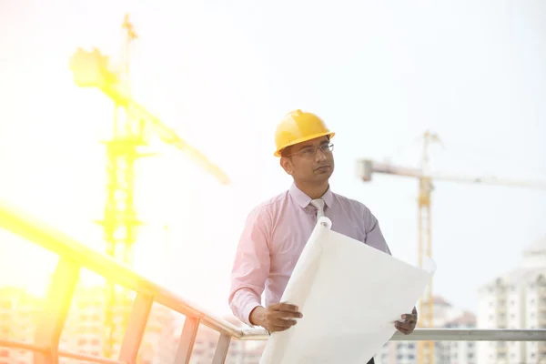 Indian engineer on construction background — Stock Photo, Image