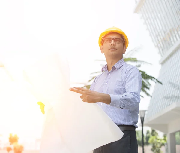 Indian engineer on construction background — Stock Photo, Image