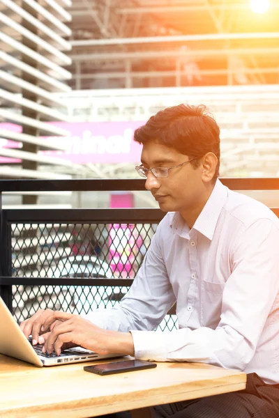 Indian man with computer — Stock Photo, Image