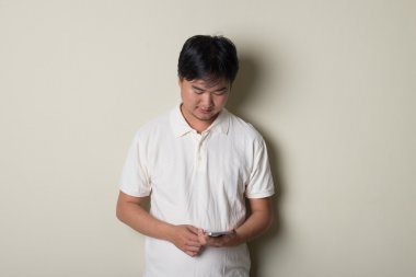 asian male with  phone