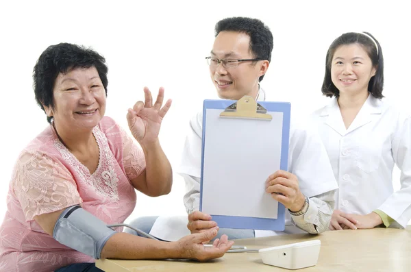 Doctor, his nurse and senior patient — 스톡 사진