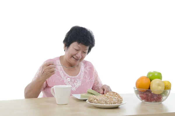 Asiatiska senior kvinna matsal — Stockfoto
