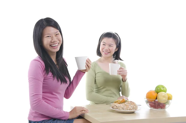 Asian sisters dining — Stock Photo, Image