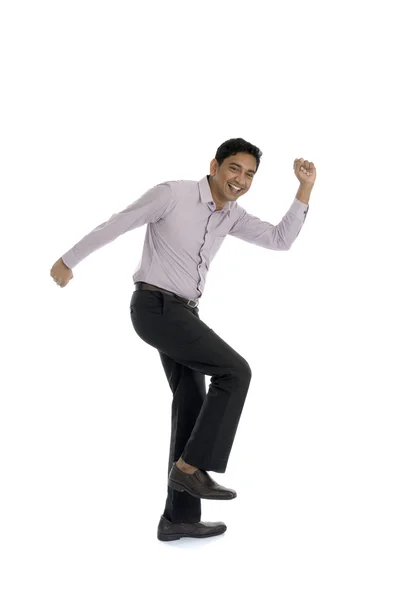 Excited Indian businessman jumping for joy. — Stock Photo, Image