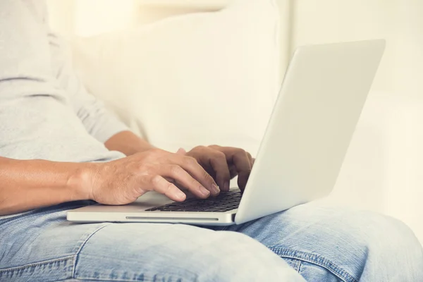 Asian man using laptop — Stock Photo, Image