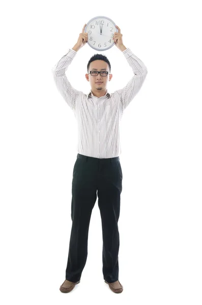 Asian business man holding a clock — Stock Photo, Image