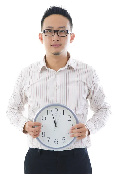 Asian business man holding a clock — Stock Photo, Image