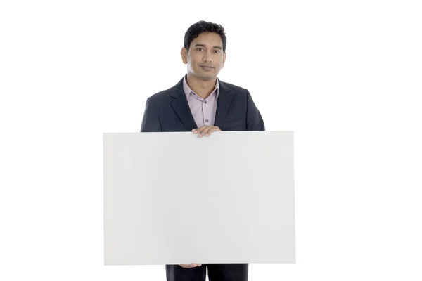 Business man with blank cardboard — Stock Photo, Image
