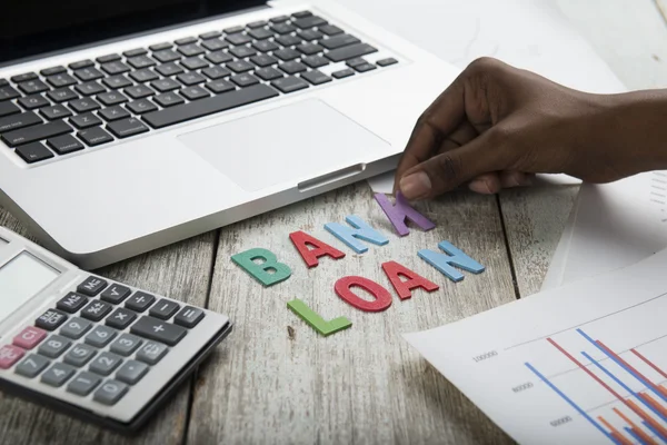 Wood letters as Bank Loan word — Stockfoto